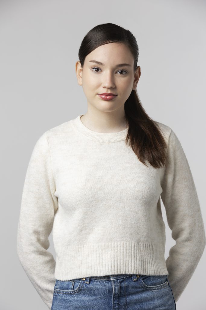girl wearing white t shirt posing studio