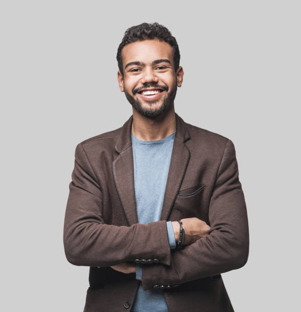 cheerful young men looking to the camera. isolated on gray background